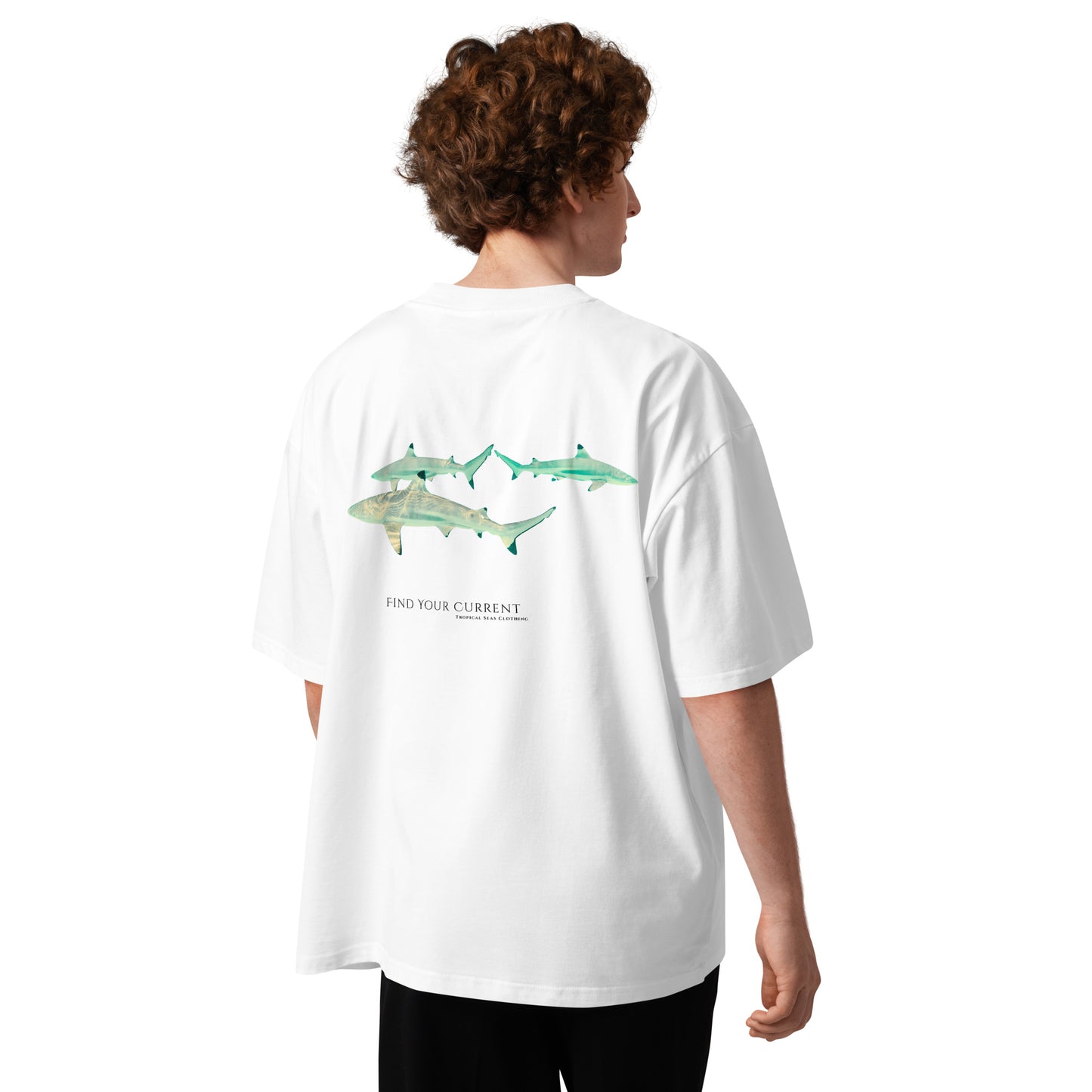 Model wearing the oversized Blacktip Reef Shark T-shirt with real underwater shark photography on the back