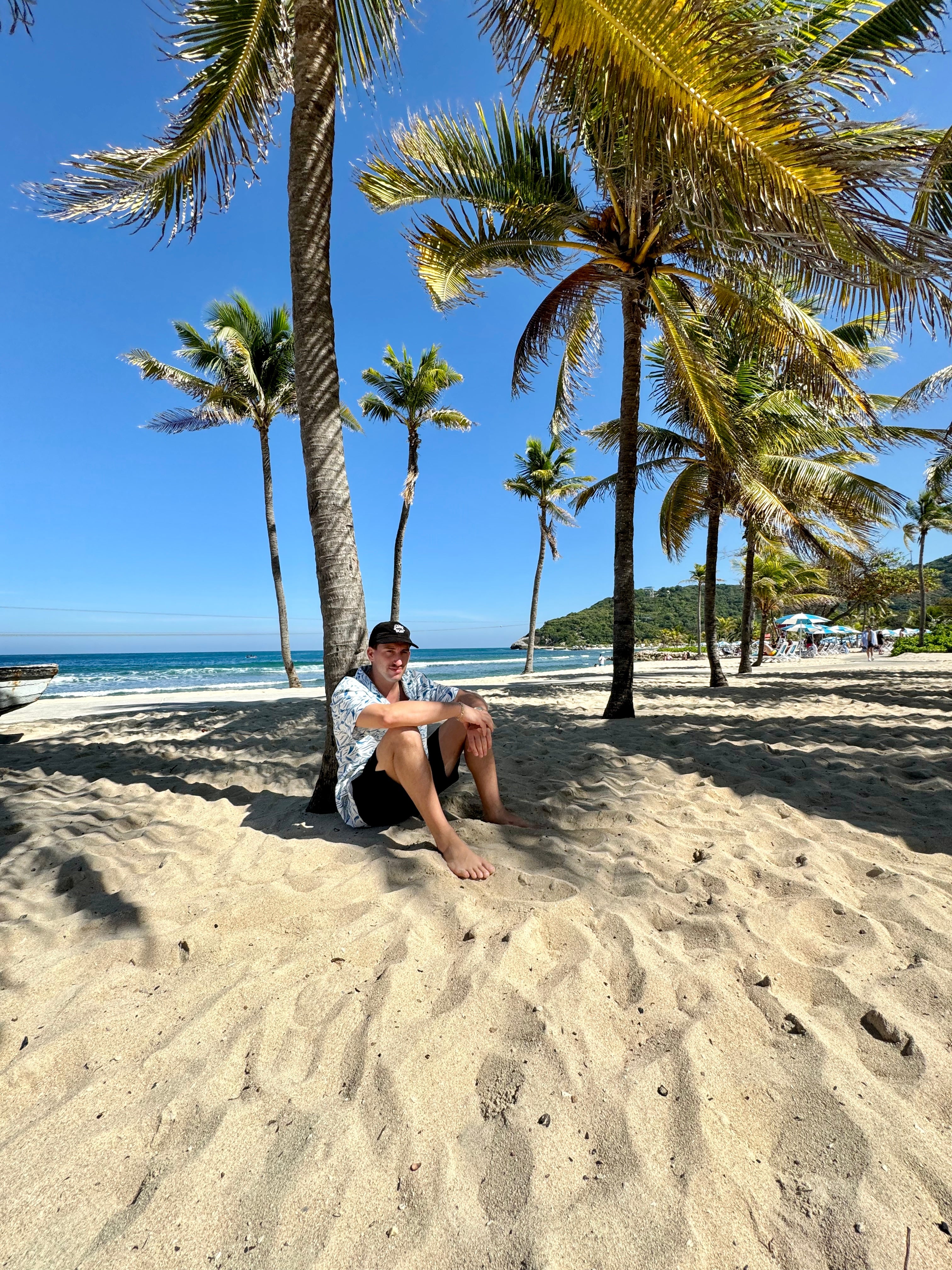 Tropical Seas Clothings Home Page feature model on beach with products